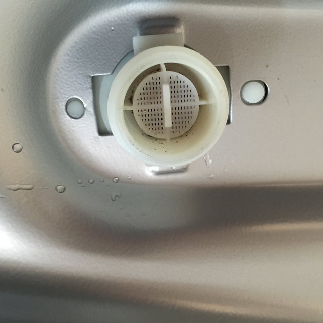 Filter is seen on fitting within washing machine